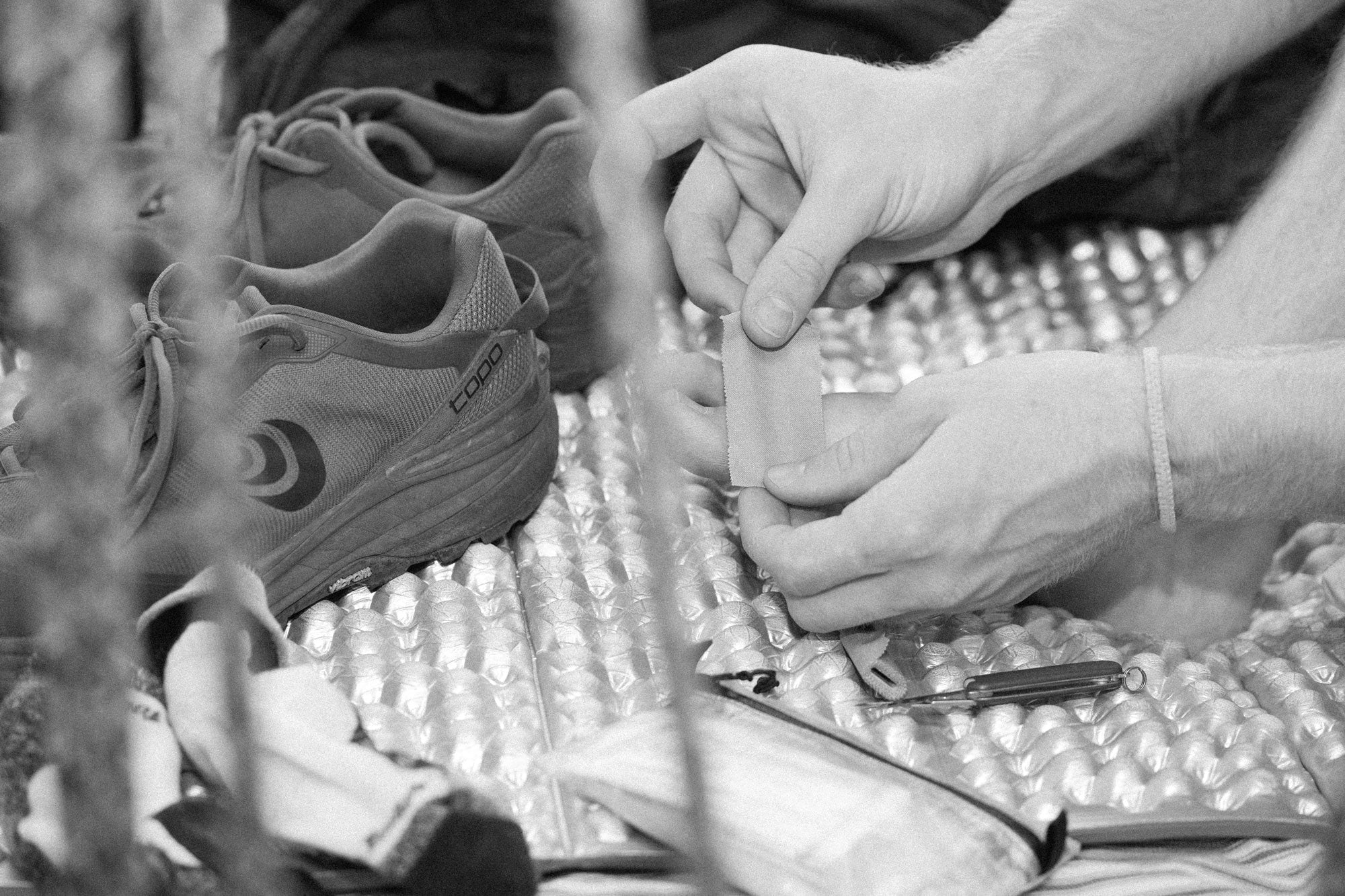 Leukotape applied to a hiker's heel to prevent blisters on a long-distance hike