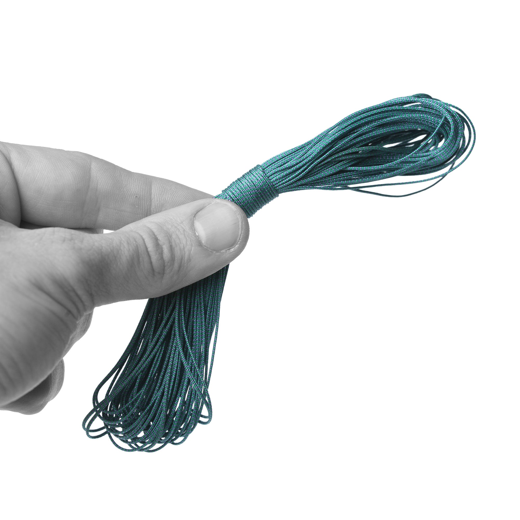 Hand holding a coiled 50 ft length of green and purple ThruLine 1 mm guyline.